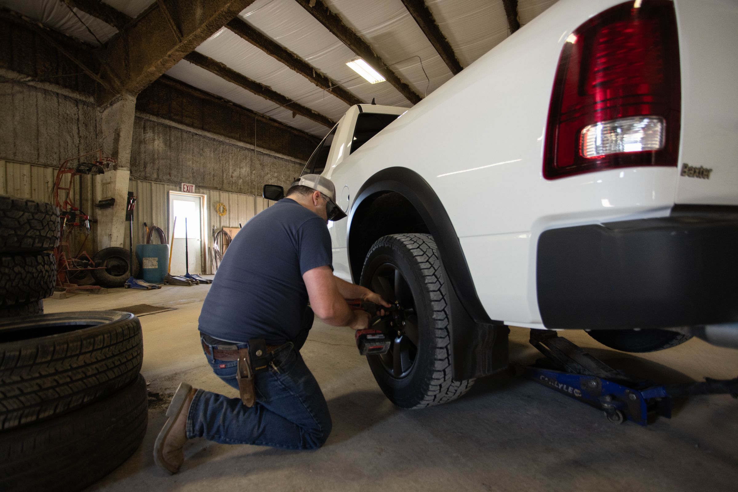 Employee fixing tire